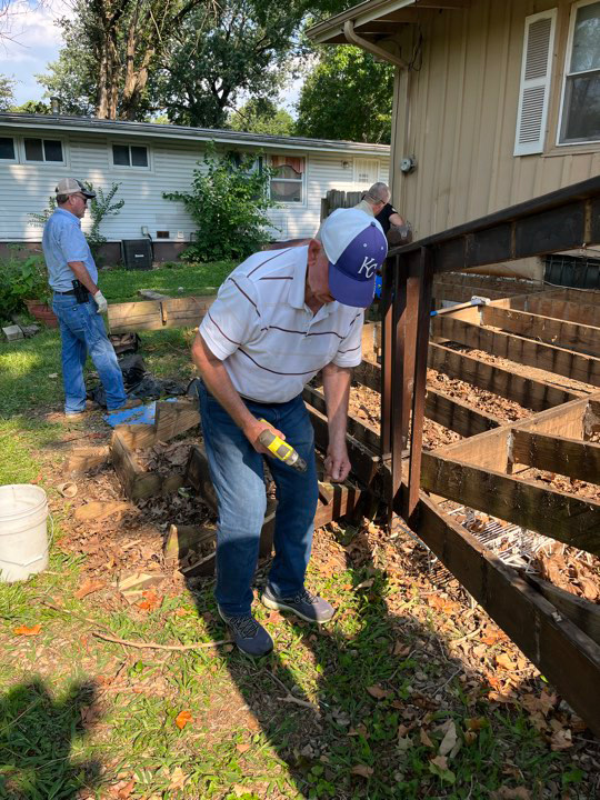 minor home repair man doing deck repair